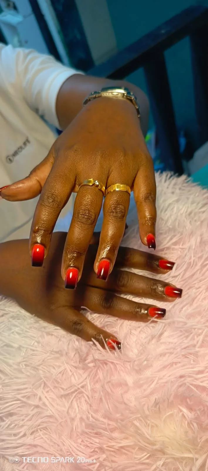 Glossy square nails fading from red into black, supplied by NBD